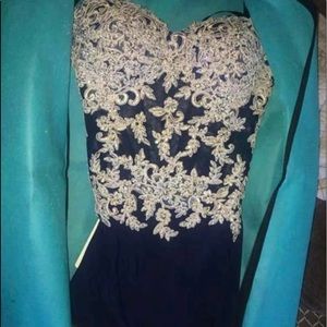 Beautiful navy blue and gold prom dress only worn once fits size 4-6
